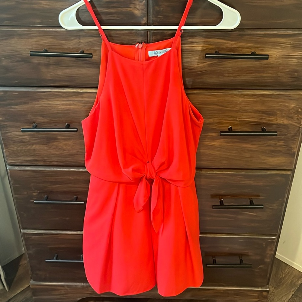 Red romper with knot detail